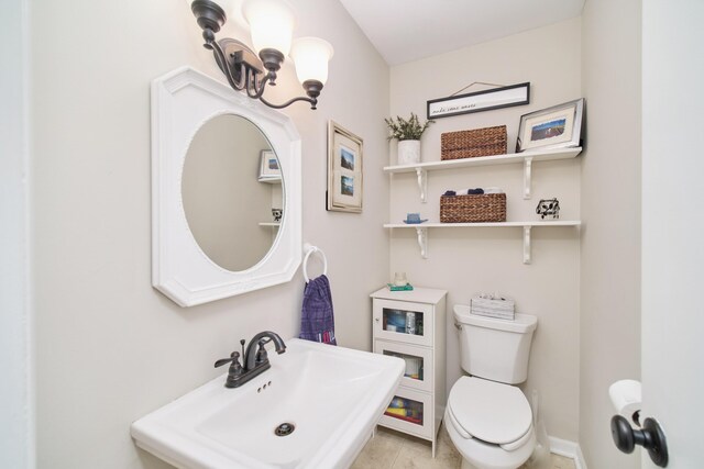 819 Elm St, Manistee, MI 49660 - half bathroom featuring toilet and a sink