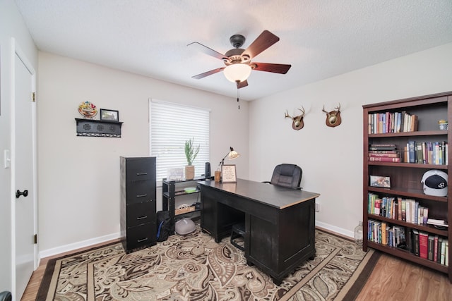 819 Elm St, Manistee, MI 49660 - office featuring ceiling fan, light wood-style floors, and baseboards