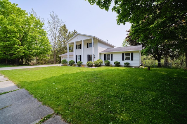 819 Elm St, Manistee, MI 49660 - greek revival inspired property with concrete driveway