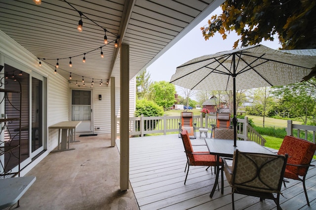 819 Elm St, Manistee, MI 49660 - deck with outdoor dining space