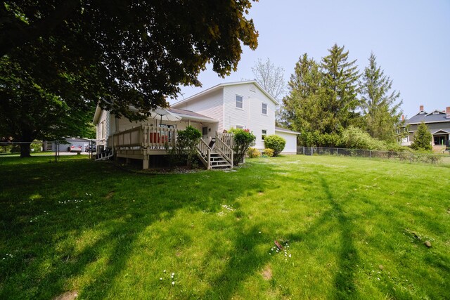 819 Elm St, Manistee, MI 49660 - view of yard featuring a deck