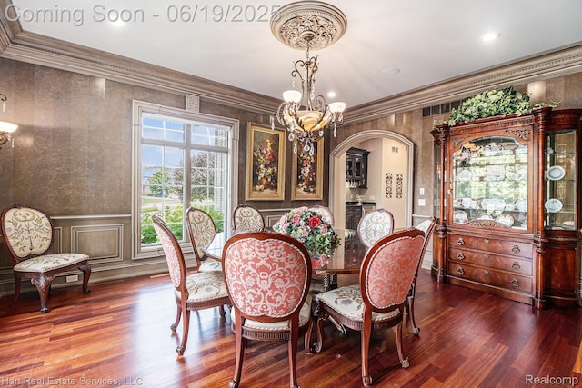 11384 Scarborough Dr, Shelby Twp, MI 48315 - dining space with a chandelier, wood finished floors, arched walkways, ornamental molding, and recessed lighting