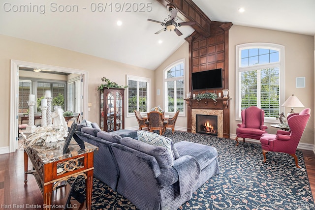 11384 Scarborough Dr, Shelby Twp, MI 48315 - living area with wood finished floors, plenty of natural light, beamed ceiling, ceiling fan, and a fireplace