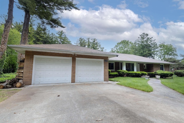 4680 Pinehaven Dr, Saginaw, MI 48638 - single story home featuring driveway, brick siding, an attached garage, a front yard, and a shingled roof