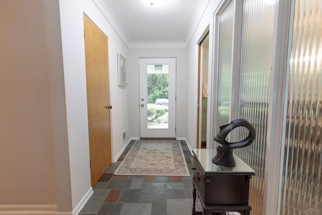 4680 Pinehaven Dr, Saginaw, MI 48638 - doorway to outside featuring stone finish floors and baseboards