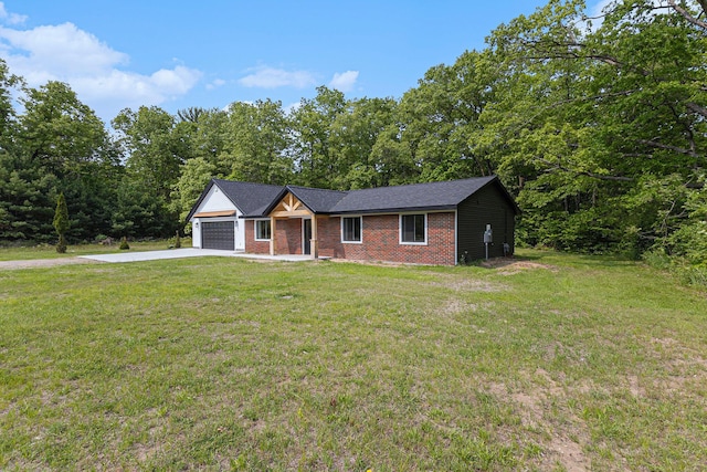 2051 Russell Rd, Muskegon, MI 49445 - ranch-style home with concrete driveway, an attached garage, brick siding, and a front yard