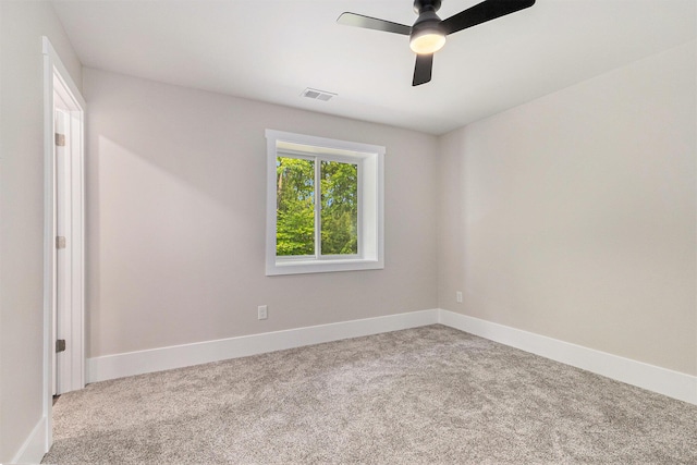 2051 Russell Rd, Muskegon, MI 49445 - carpeted empty room featuring a ceiling fan and baseboards