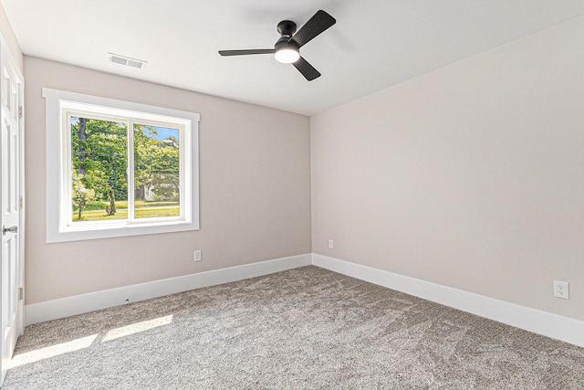 2051 Russell Rd, Muskegon, MI 49445 - carpeted spare room featuring a ceiling fan and baseboards