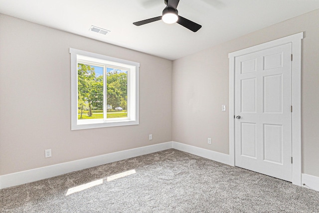 2051 Russell Rd, Muskegon, MI 49445 - empty room featuring ceiling fan, carpet flooring, and baseboards