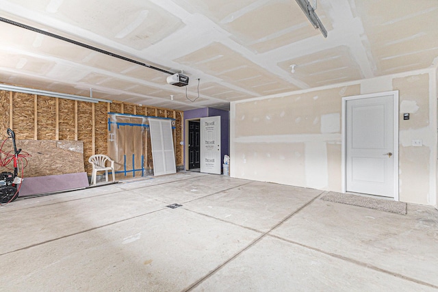 2051 Russell Rd, Muskegon, MI 49445 - garage featuring a garage door opener