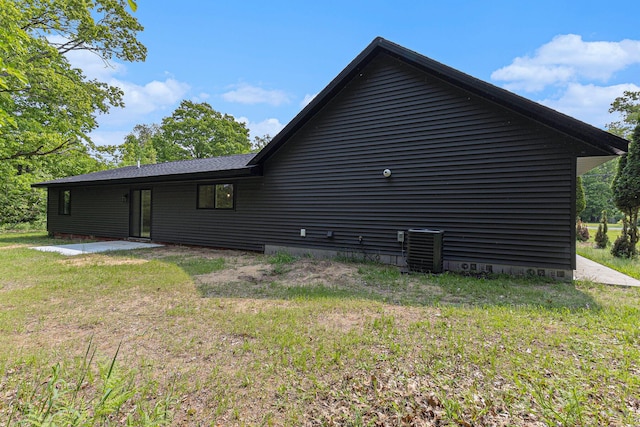 2051 Russell Rd, Muskegon, MI 49445 - view of property exterior featuring central AC and crawl space