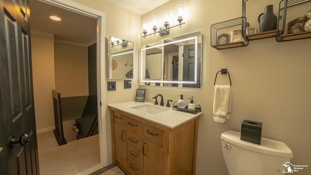 27028 Winchester St, Trenton, MI 48183 - bathroom featuring vanity, toilet, and crown molding