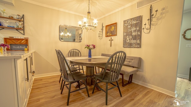 27028 Winchester St, Trenton, MI 48183 - dining room featuring a chandelier, light wood-style floors, crown molding, and baseboards