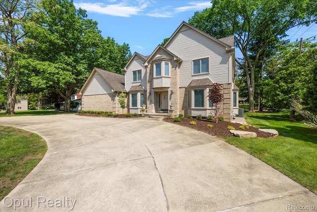 37456 Rhonswood Dr, Northville, MI 48167 - view of front facade with a front yard and concrete driveway