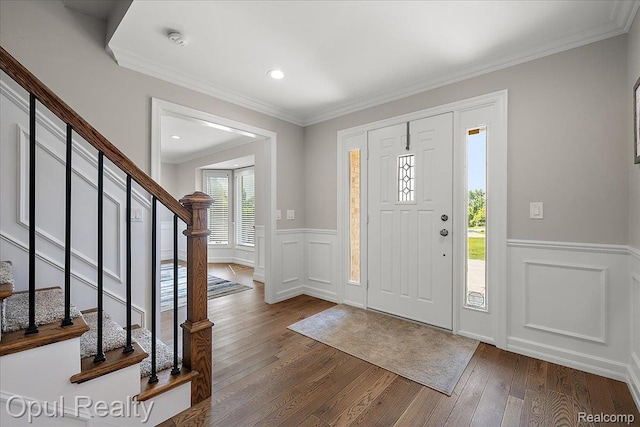 37456 Rhonswood Dr, Northville, MI 48167 - entryway with dark wood finished floors, stairs, wainscoting, a decorative wall, and crown molding