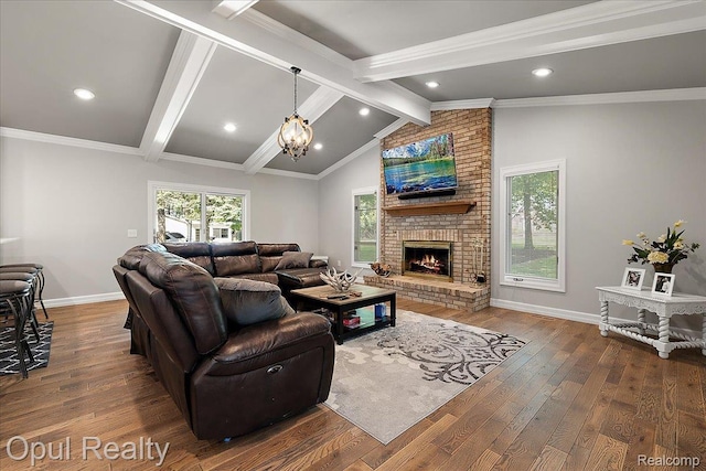 37456 Rhonswood Dr, Northville, MI 48167 - living room featuring wood finished floors, a fireplace, baseboards, recessed lighting, and a chandelier