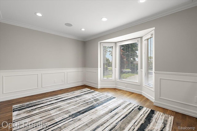 37456 Rhonswood Dr, Northville, MI 48167 - spare room with ornamental molding, a wainscoted wall, wood finished floors, and recessed lighting