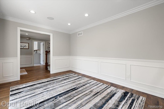 37456 Rhonswood Dr, Northville, MI 48167 - unfurnished room featuring wood finished floors, a wainscoted wall, crown molding, recessed lighting, and a decorative wall