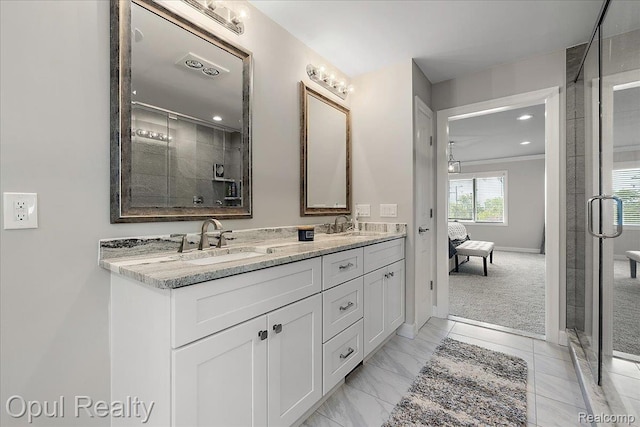 37456 Rhonswood Dr, Northville, MI 48167 - ensuite bathroom featuring double vanity, a stall shower, baseboards, and recessed lighting