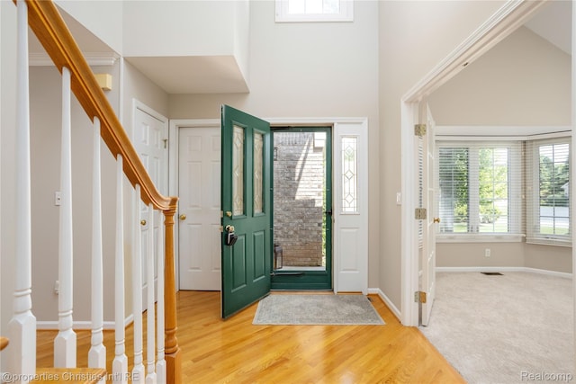 45330 Stonehedge Dr Unit 2, Plymouth, MI 48170 - entryway with stairs, wood finished floors, and a high ceiling