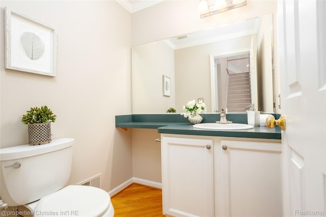 45330 Stonehedge Dr Unit 2, Plymouth, MI 48170 - half bathroom featuring ornamental molding, vanity, and wood finished floors