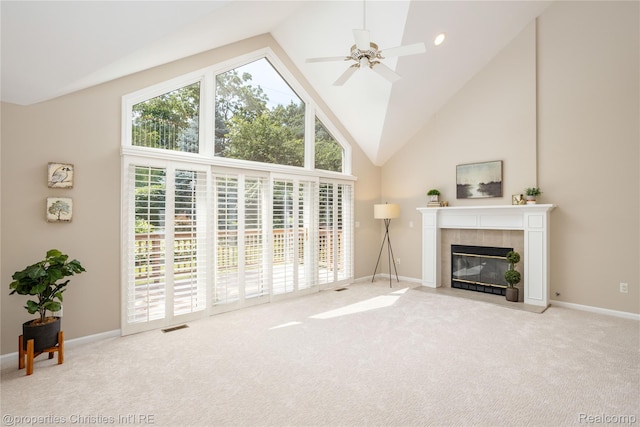 45330 Stonehedge Dr Unit 2, Plymouth, MI 48170 - carpeted living room with high vaulted ceiling, healthy amount of natural light, a tile fireplace, and a ceiling fan