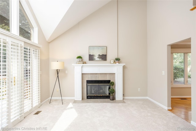 45330 Stonehedge Dr Unit 2, Plymouth, MI 48170 - carpeted living area with high vaulted ceiling and a fireplace