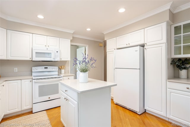 45330 Stonehedge Dr Unit 2, Plymouth, MI 48170 - kitchen with white appliances, light countertops, ornamental molding, light wood-style floors, and a kitchen island