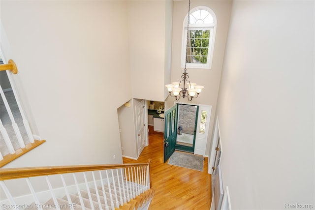 45330 Stonehedge Dr Unit 2, Plymouth, MI 48170 - entrance foyer featuring a chandelier, light wood-type flooring, and a high ceiling