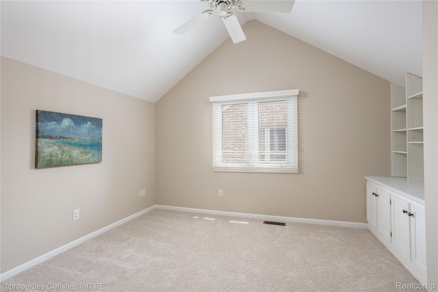 45330 Stonehedge Dr Unit 2, Plymouth, MI 48170 - unfurnished room with ceiling fan, light carpet, and vaulted ceiling