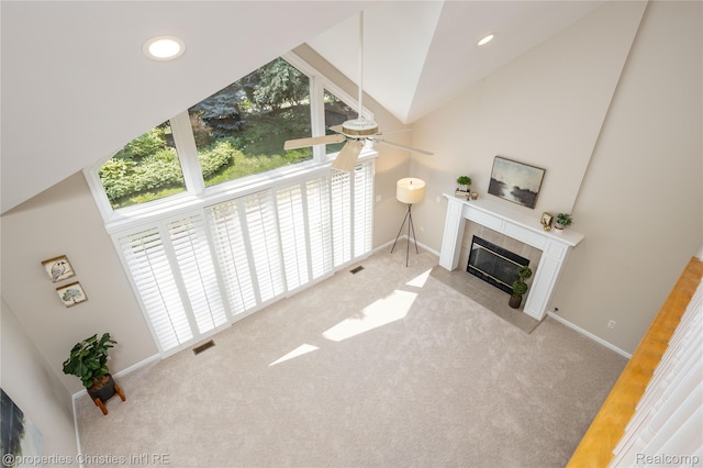 45330 Stonehedge Dr Unit 2, Plymouth, MI 48170 - carpeted living area featuring a tile fireplace, ceiling fan, high vaulted ceiling, and recessed lighting