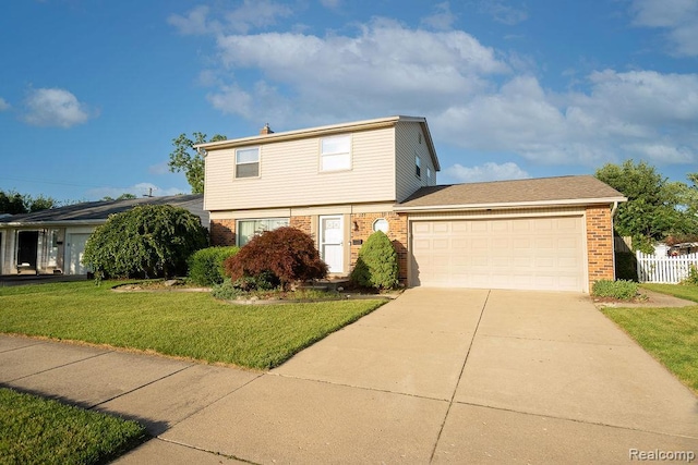 15065 Westlake St, Taylor, MI 48180 - colonial house with brick siding, concrete driveway, and an attached garage