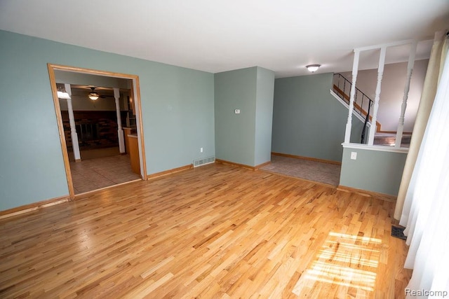 15065 Westlake St, Taylor, MI 48180 - spare room with wood finished floors, ceiling fan, and stairs