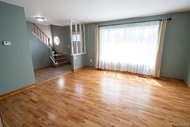 15065 Westlake St, Taylor, MI 48180 - unfurnished living room featuring stairway and wood finished floors