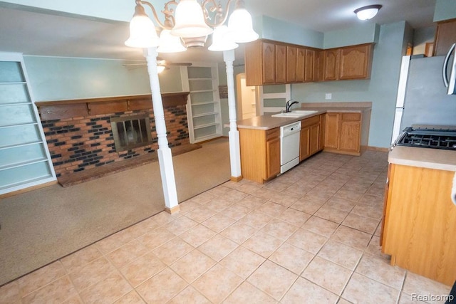 15065 Westlake St, Taylor, MI 48180 - kitchen featuring stainless steel appliances, light countertops, a ceiling fan, and a brick fireplace