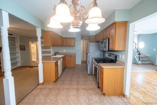15065 Westlake St, Taylor, MI 48180 - kitchen with stainless steel appliances, light countertops, a chandelier, and light tile patterned flooring
