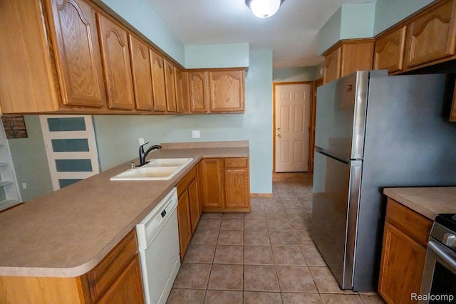 15065 Westlake St, Taylor, MI 48180 - kitchen featuring stainless steel appliances, light countertops, brown cabinets, and light tile patterned floors