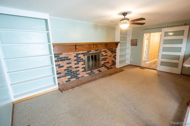 15065 Westlake St, Taylor, MI 48180 - unfurnished living room with ceiling fan, a brick fireplace, carpet, and a barn door