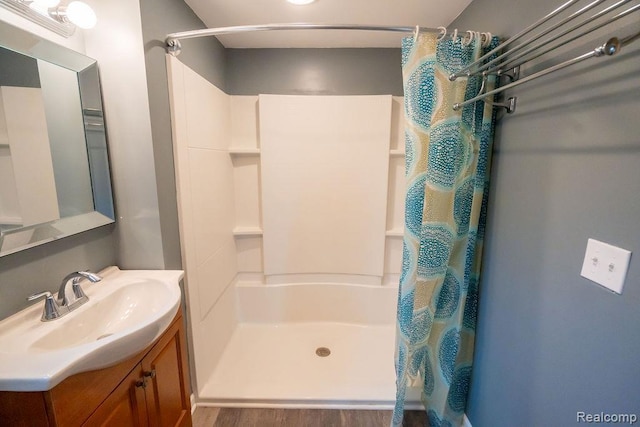 15065 Westlake St, Taylor, MI 48180 - full bath with curtained shower, vanity, and wood finished floors