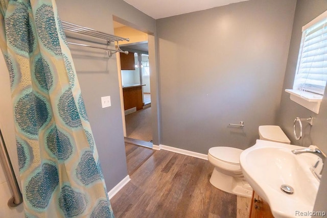 15065 Westlake St, Taylor, MI 48180 - full bath with wood finished floors, a shower with curtain, and vanity