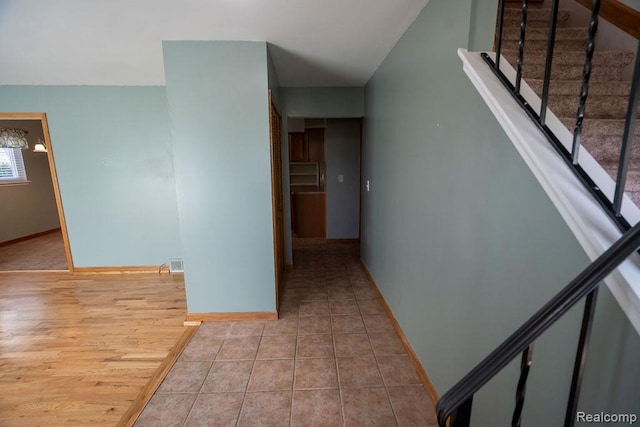 15065 Westlake St, Taylor, MI 48180 - hall with stairs, tile patterned flooring, and a chandelier