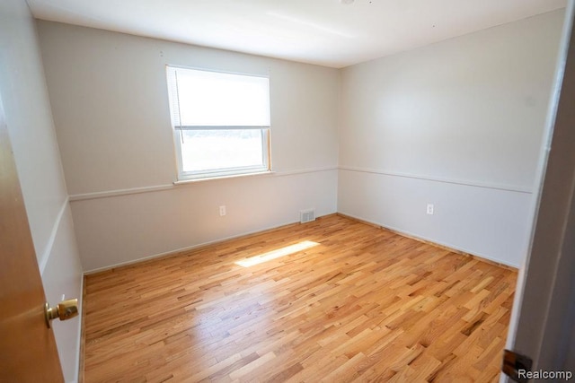 15065 Westlake St, Taylor, MI 48180 - empty room with wood finished floors and baseboards