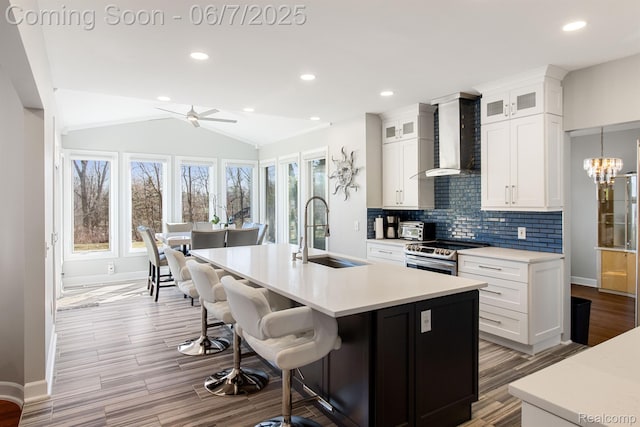 1079 Forest Bay Dr, Waterford, MI 48328 - kitchen with a sink, electric range, wall chimney range hood, tasteful backsplash, and ceiling fan