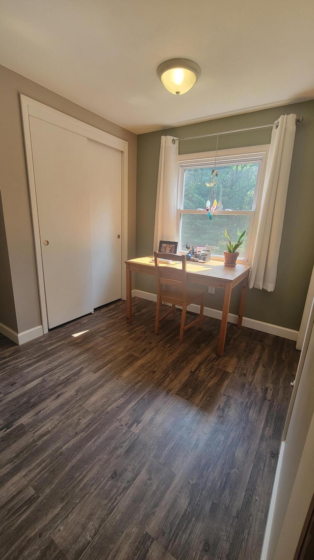 11390 Patterson Rd, Ravenna, MI 49451 - dining area featuring dark wood-style flooring and baseboards
