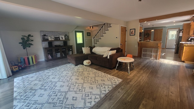 11390 Patterson Rd, Ravenna, MI 49451 - living room with stairs, dark wood-type flooring, baseboards, and beam ceiling