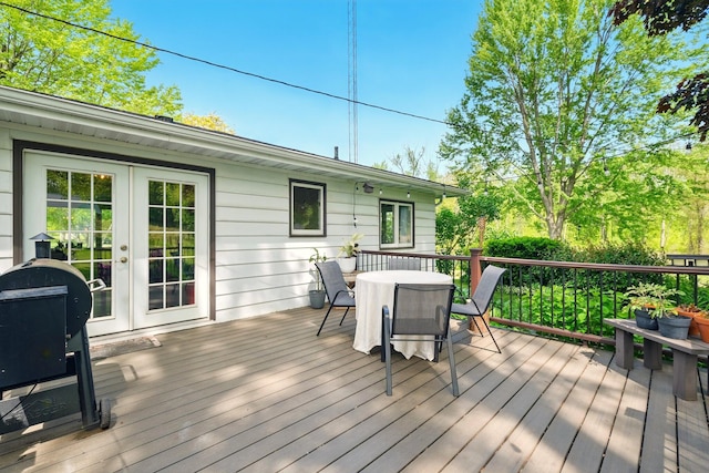 2877 Bessemer Rd, Coloma, MI 49038 - wooden deck with outdoor dining space and french doors