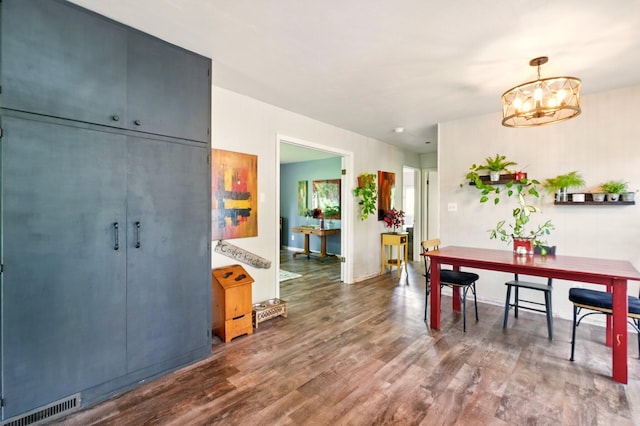 2877 Bessemer Rd, Coloma, MI 49038 - dining room featuring wood finished floors and a chandelier