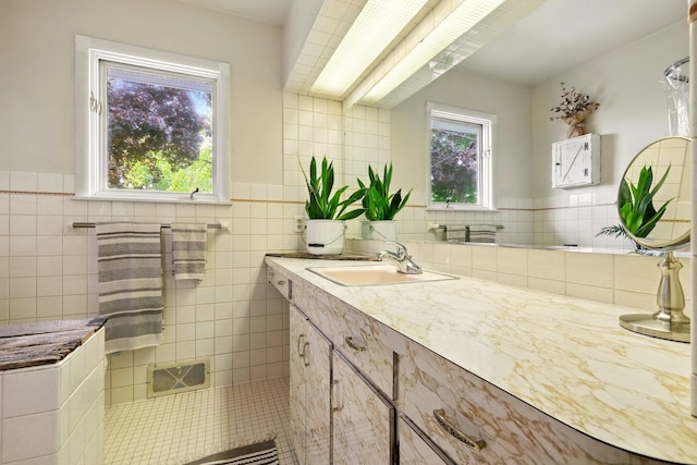 2877 Bessemer Rd, Coloma, MI 49038 - bathroom with vanity, tile walls, and wainscoting
