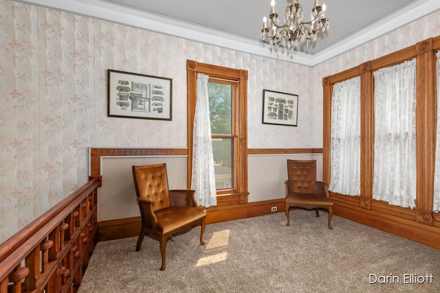 216 E Main St, Ionia, MI 48846 - sitting room with wallpapered walls, a chandelier, and carpet