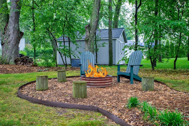 1669 Waukazoo Dr, Holland, MI 49424 - view of playground featuring a fire pit and an outbuilding
